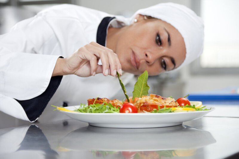 female chef preparing food